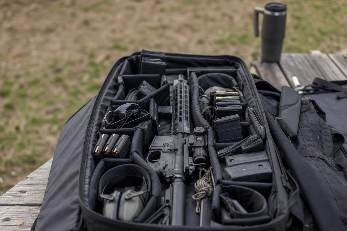 gun range essentials organized in a rifle range bag