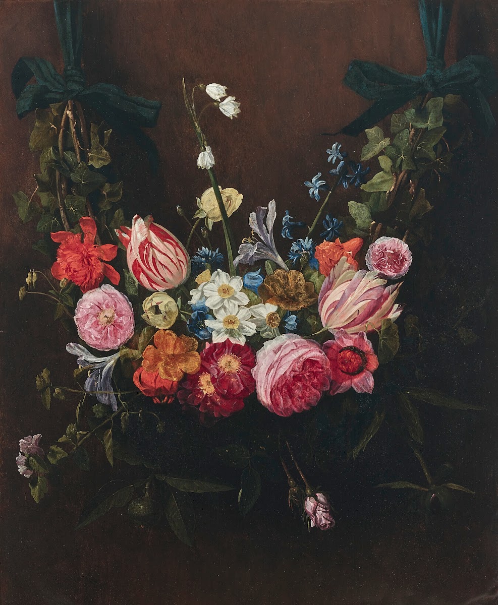 A garland of flowers with tulips daffodils lilies of the valley suspended from r