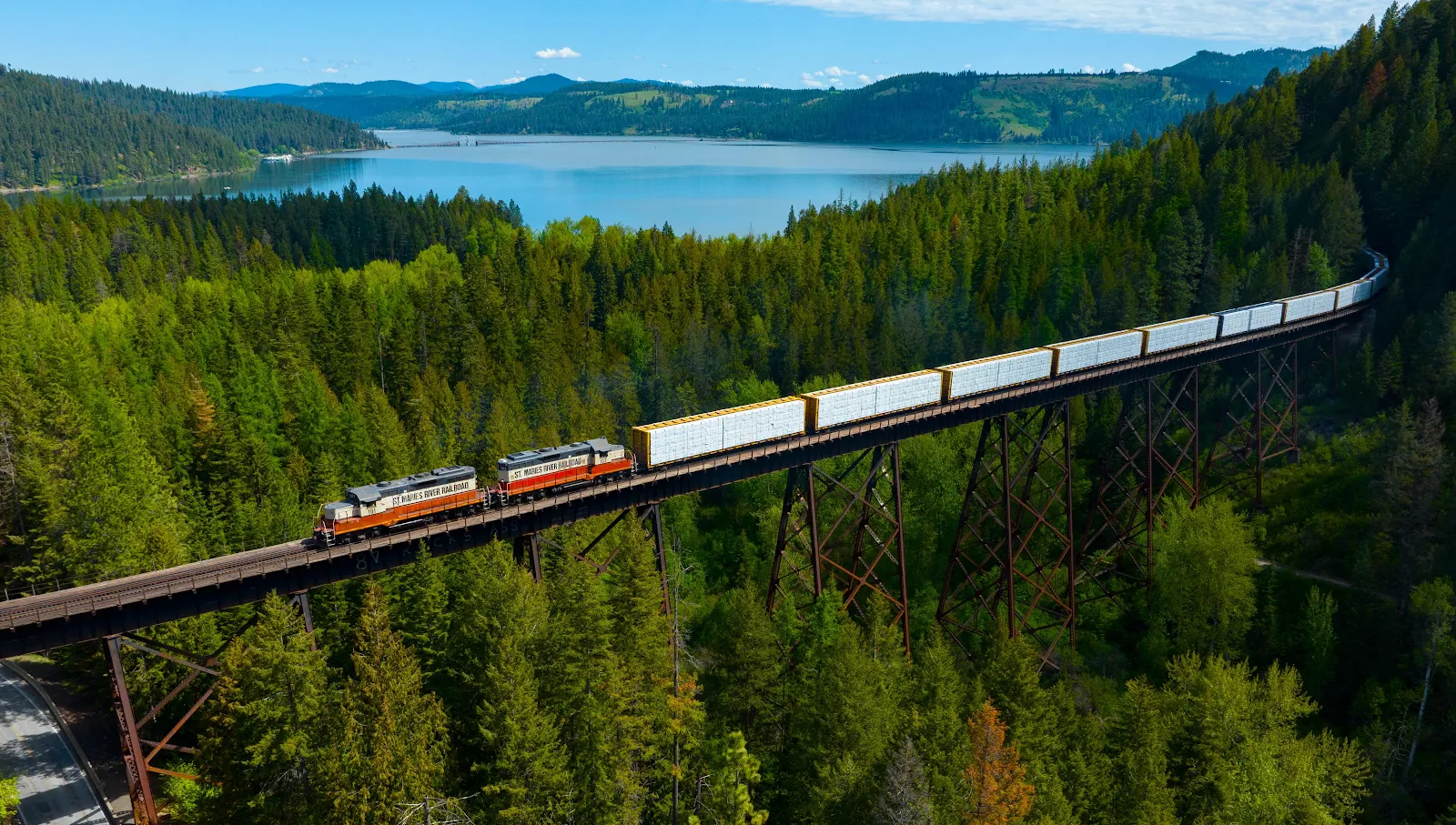 Freight Train Crossing Forest Trestle - Aerial Landscape Photography 4K Wallpaper (4771x2705)