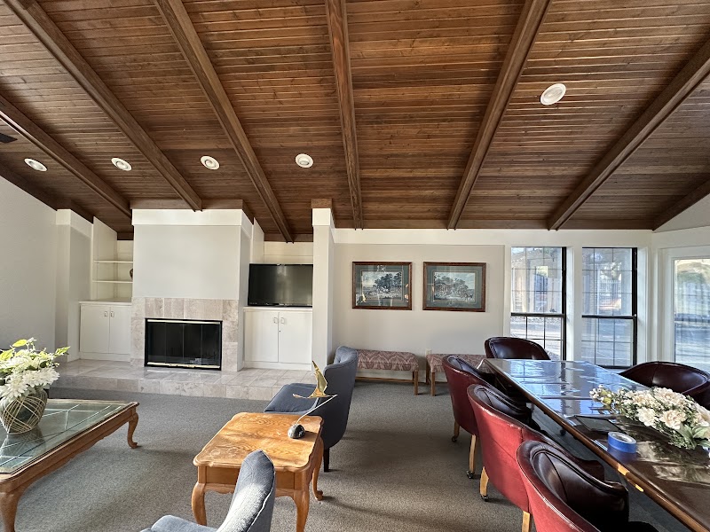 Yardley Court clubhouse great room after repaint, refreshed walls with wood ceiling preserved