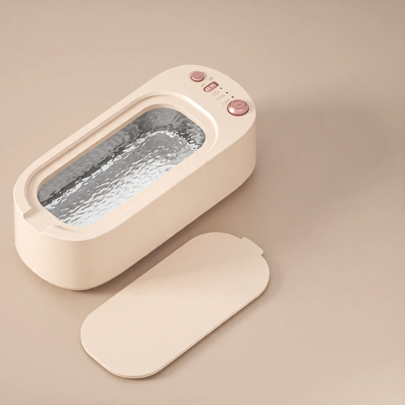 Ultrasonic cleaning device, portable, dual chamber