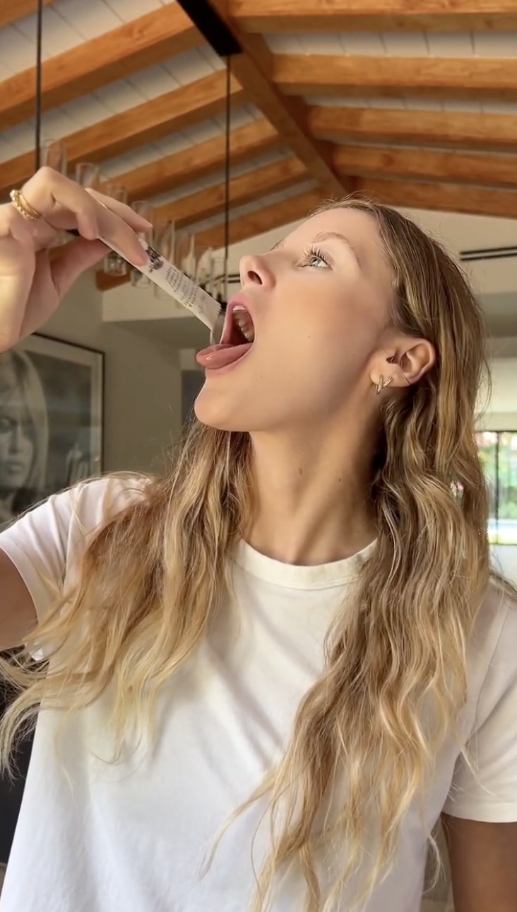 Pouring Tiger Milk Mushroom on tongue