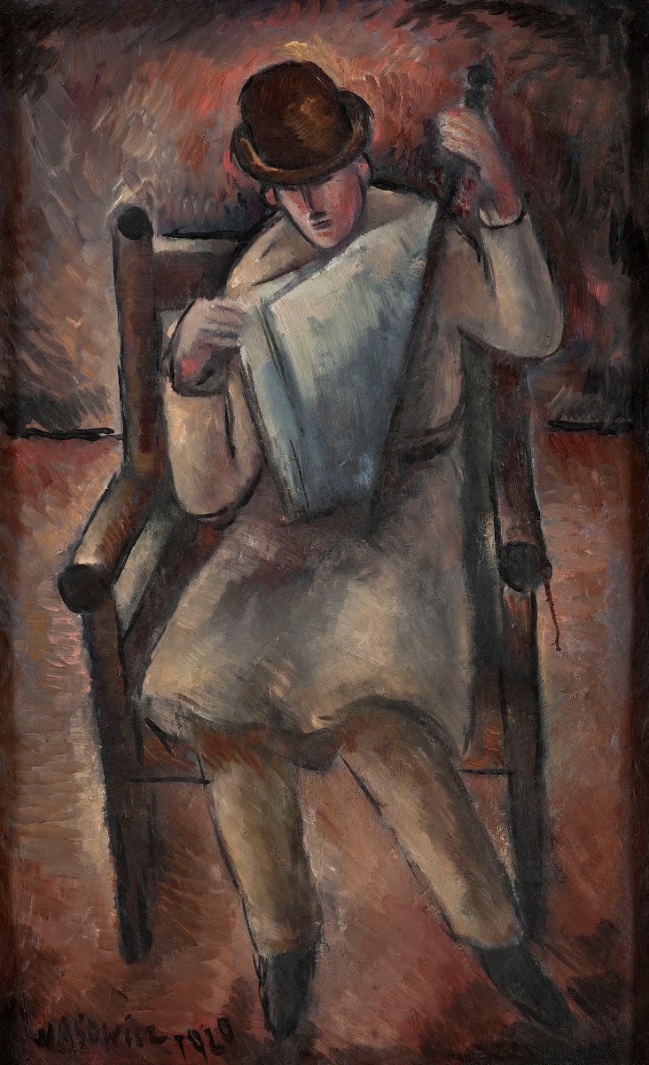 Man reading a newspaper 1920