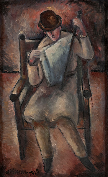 Man reading a newspaper 1920