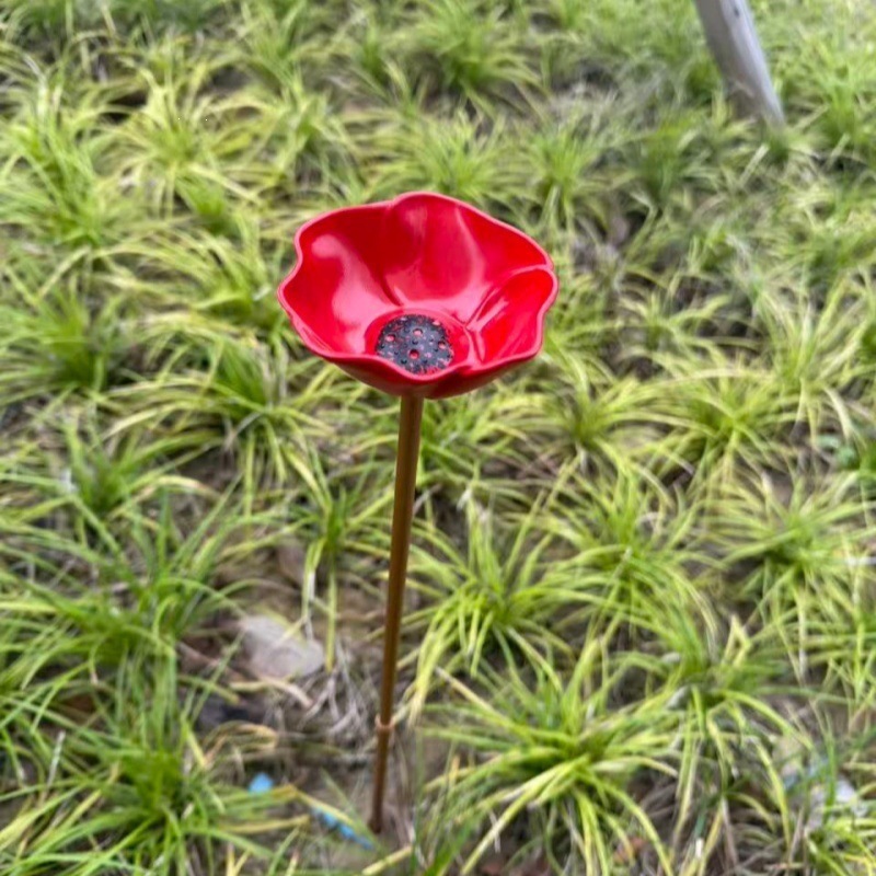 Decorative metal birdbath with ground spike