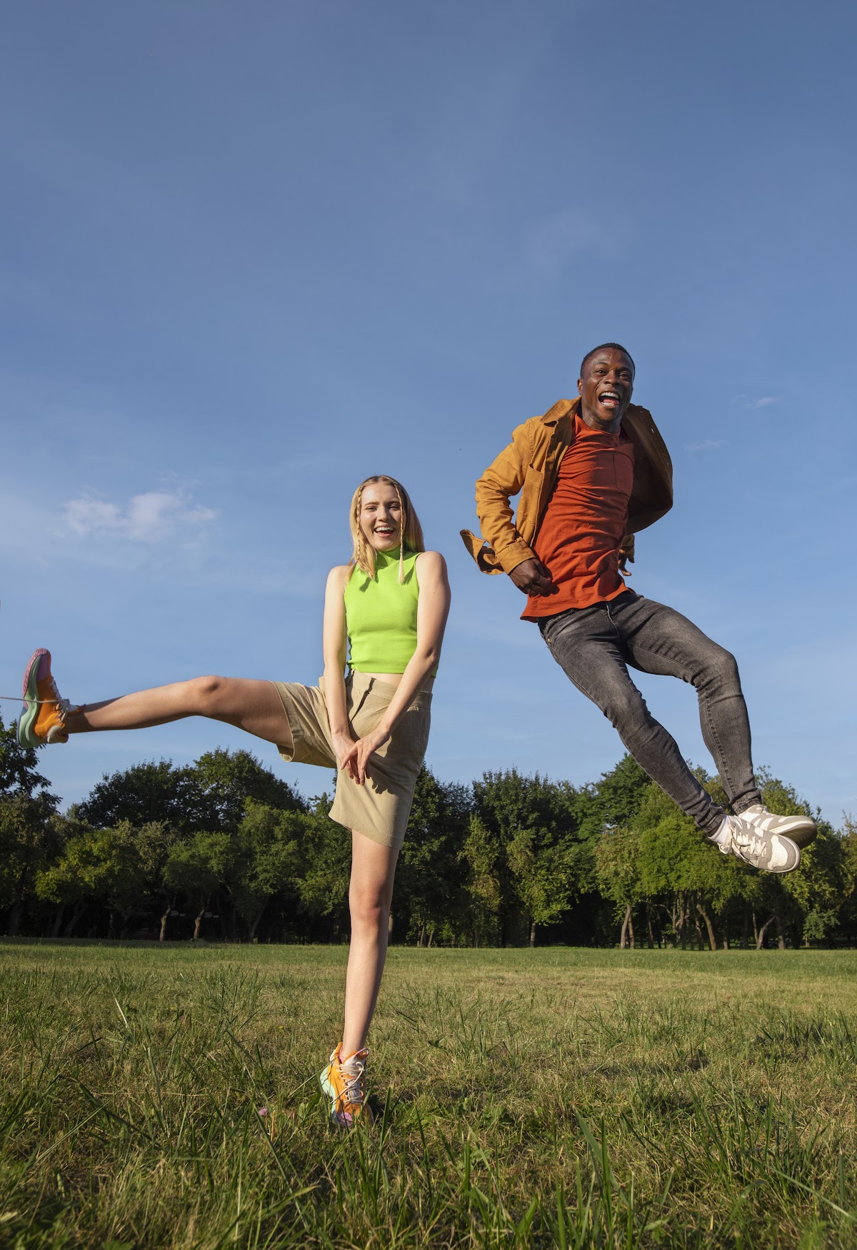 Lifestyle — jumping together in park