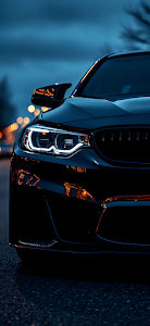 Aggressive Black Luxury Sports Car Headlight Close Up at Dusk