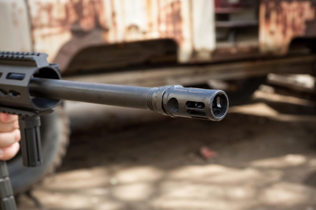 hybrid muzzle device port geometry on an AR-15