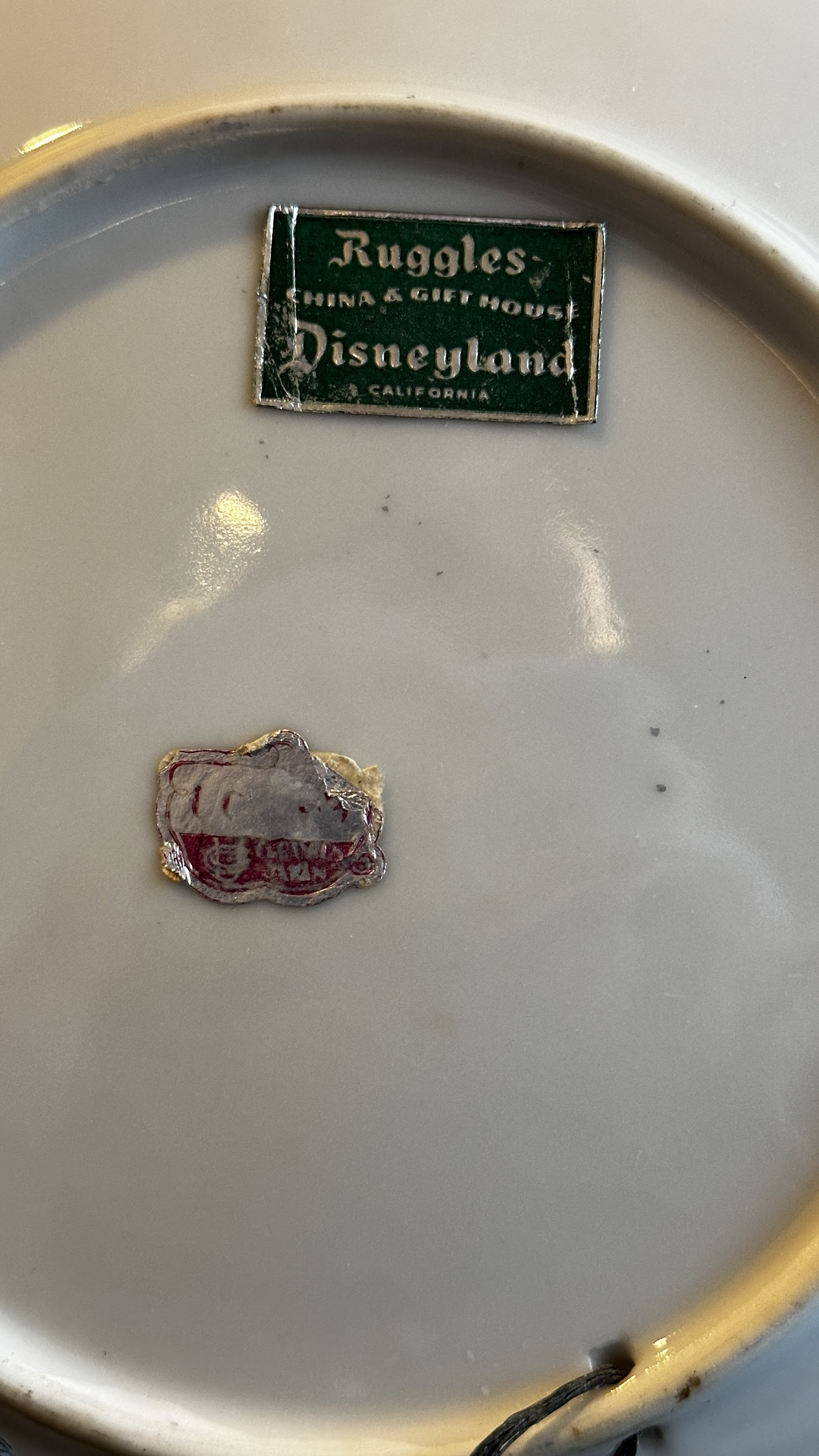 White ceramic Disneyland souvenir plate by Ruggles China Gift House, circa 1955–1964, Opening Day era Main Street USA