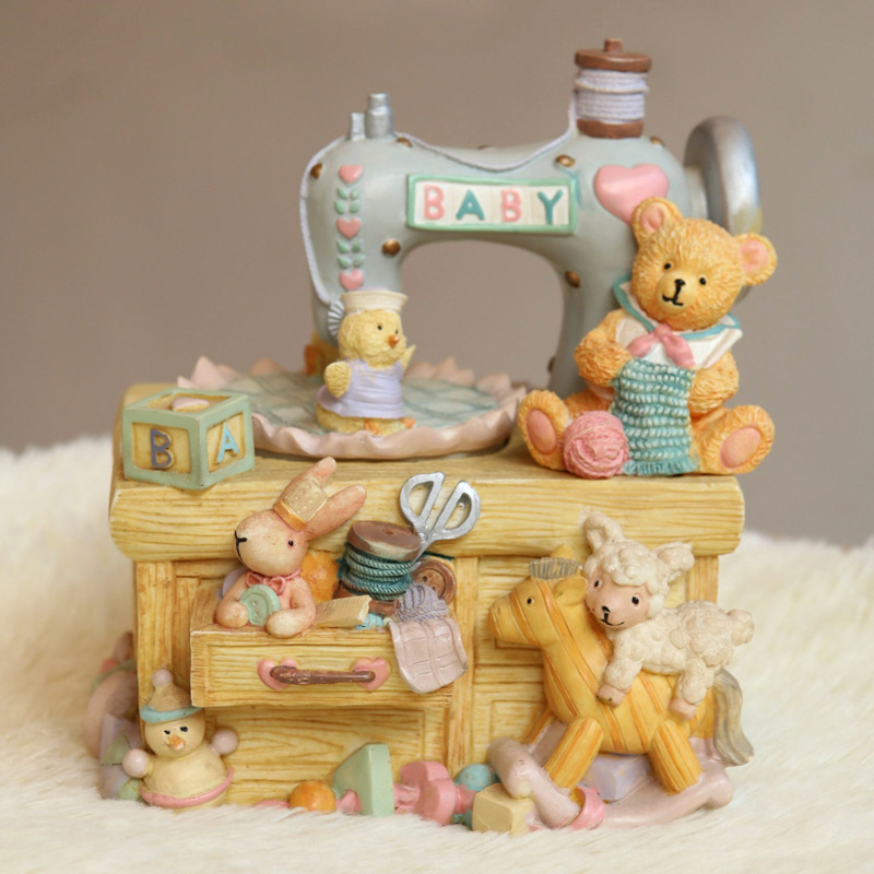 Music box in sewing machine design with bear motif