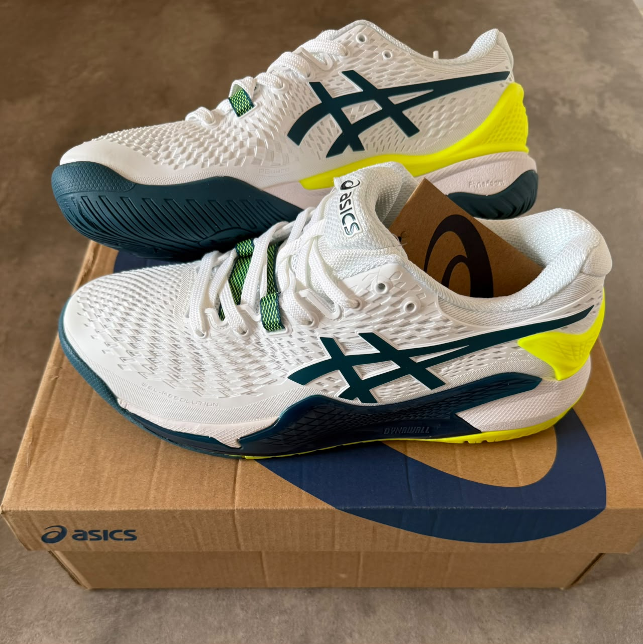 ASICS RESOLUTION 9 BLANCA AMARILLO LOGO VERDE