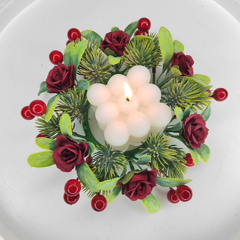 Christmas candle wreath with roses and pine needles