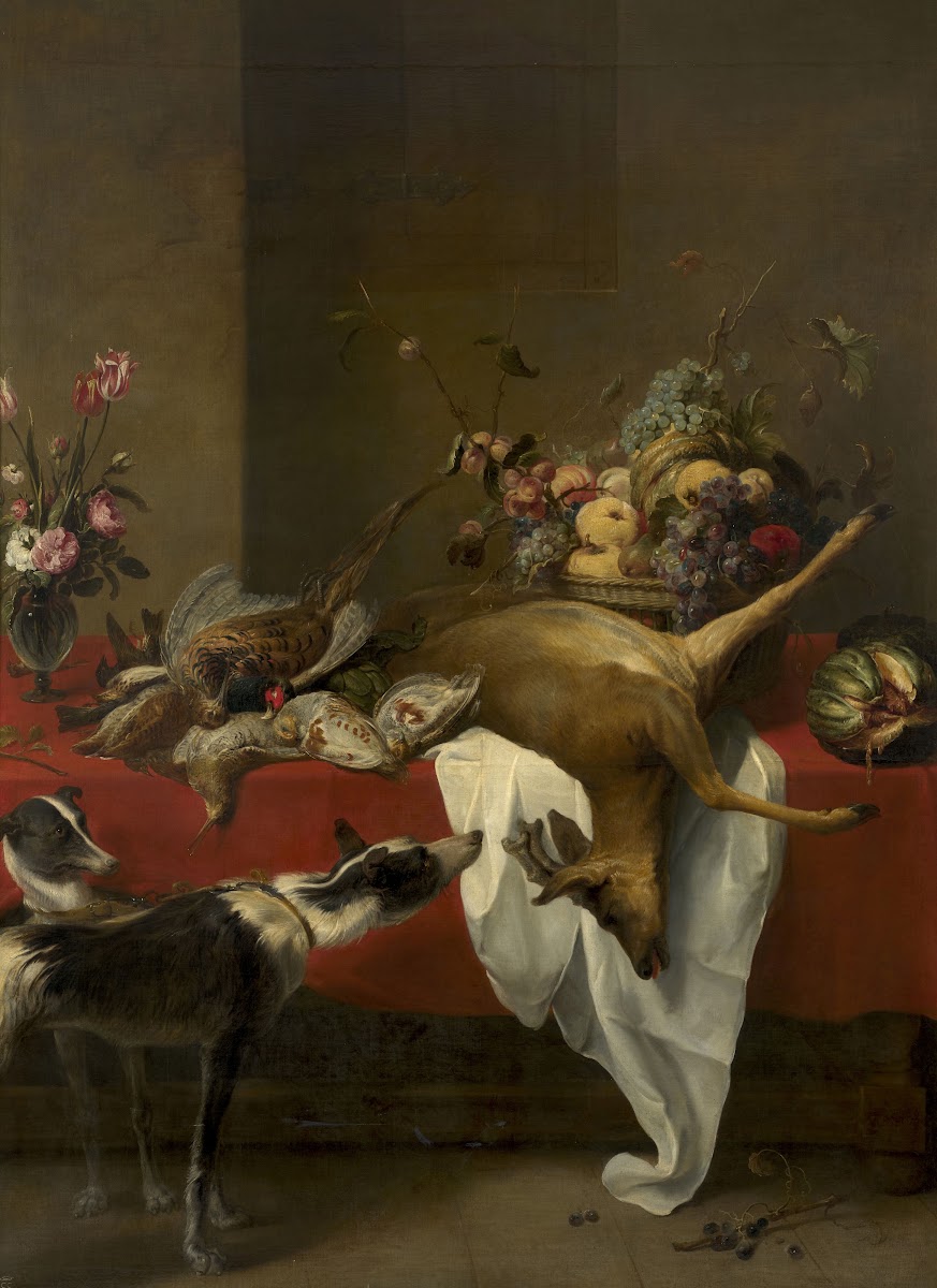 Game fruit basket and vase of flowers on a table