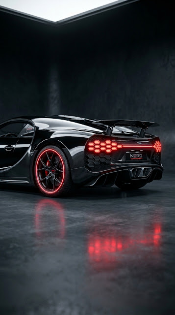 Glossy Black Supercar with Red Accent Wheels in Dark Studio - Free mobile Wallpaper