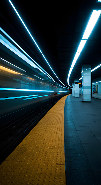 Subway Train Speeding Through Station with Blue Light Trails - Free mobile Wallpaper