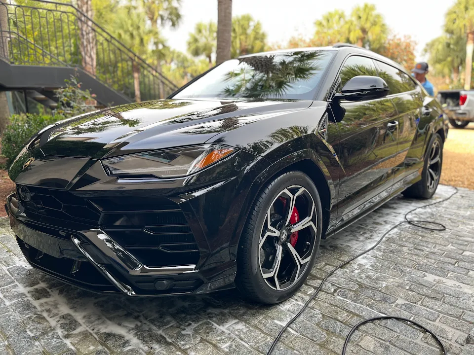 Black Lamborghini Urus parked outdoors
