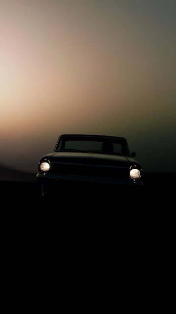 Vintage Car Silhouette Headlights Glowing at Twilight