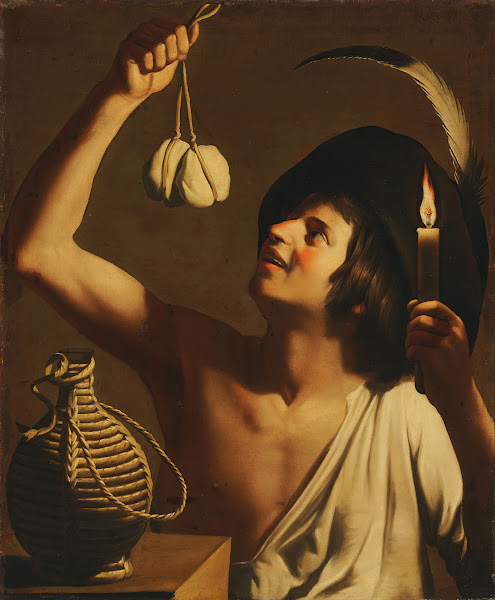 A Young Man Holding A Burning Candle And A Scamorza Cheese A Fiasco Bottle Besid