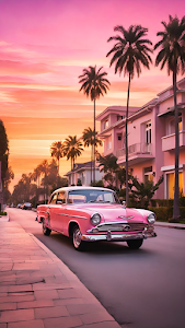 Vintage Pink Sedan Cruising Palm Tree Lined Street Sunset