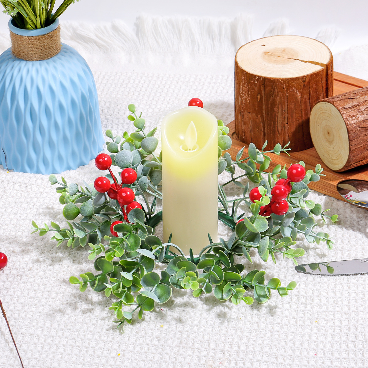 Christmas candle wreath with red berries