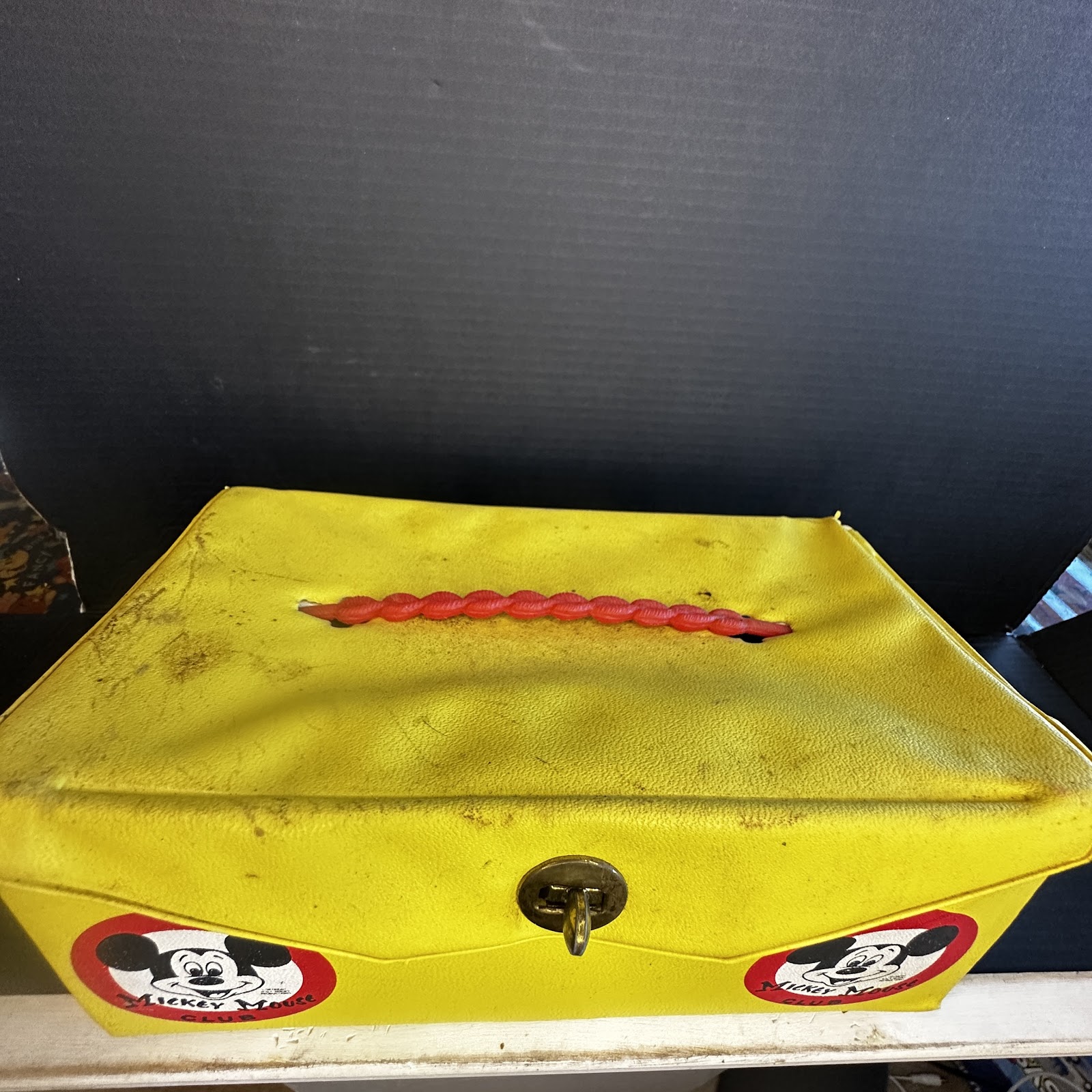 Vintage Mickey Mouse Club vinyl carrying case from circa 1955–1959 showing wear on lid and edges