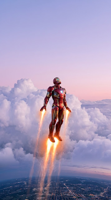 Armored Hero Soaring Above Soft Pink and Purple Sunset Clouds - Free mobile Wallpaper