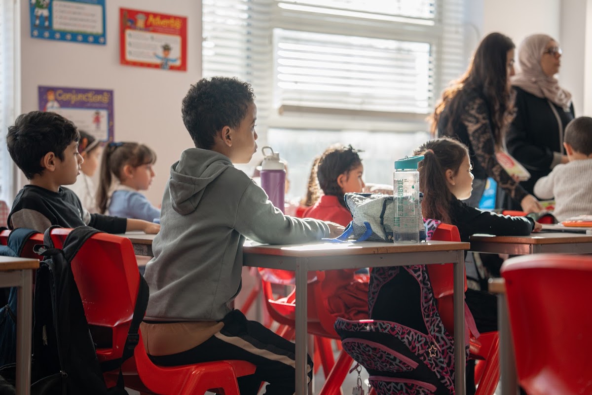 Children in class with their teacher