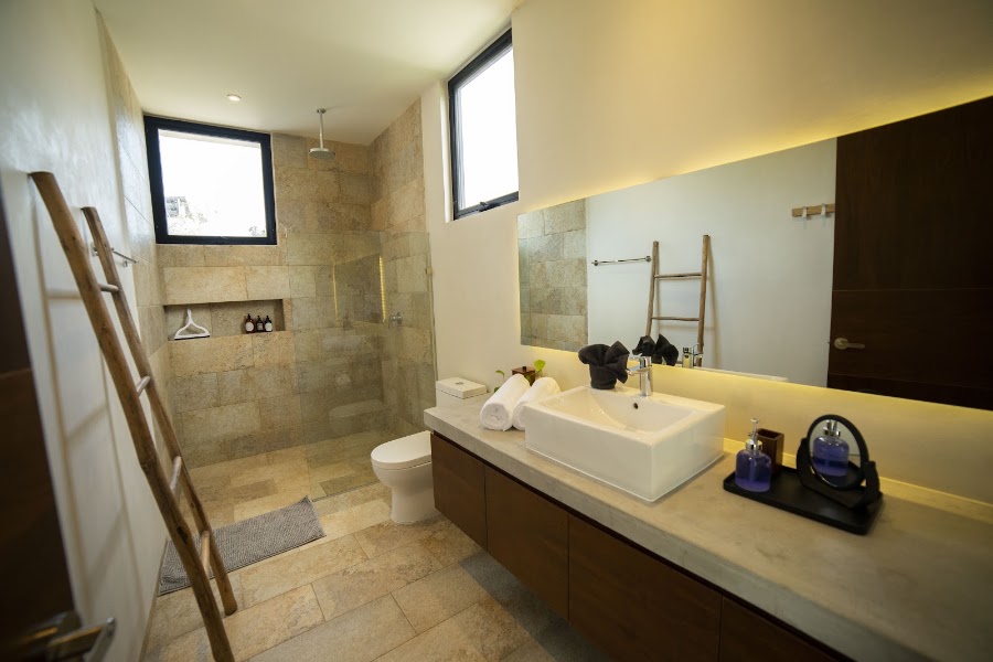 Stone vanity and walk-in shower