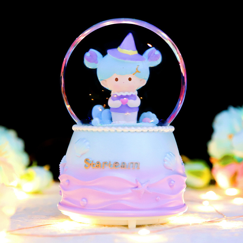 Enchanting snow globe with music and light