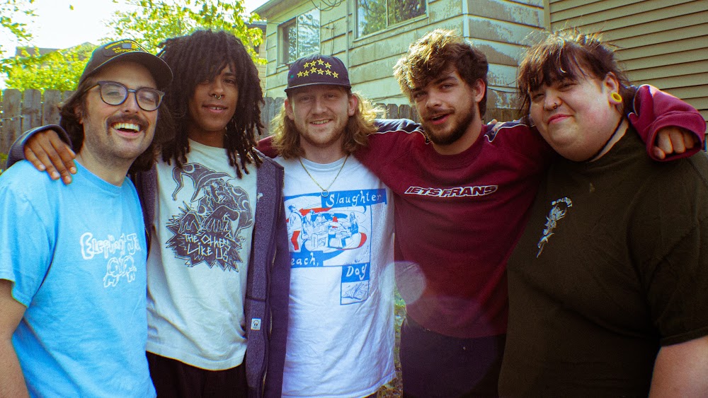 The five members of Indianapolis emo supergroup Summerbruise pose in someone's backyard