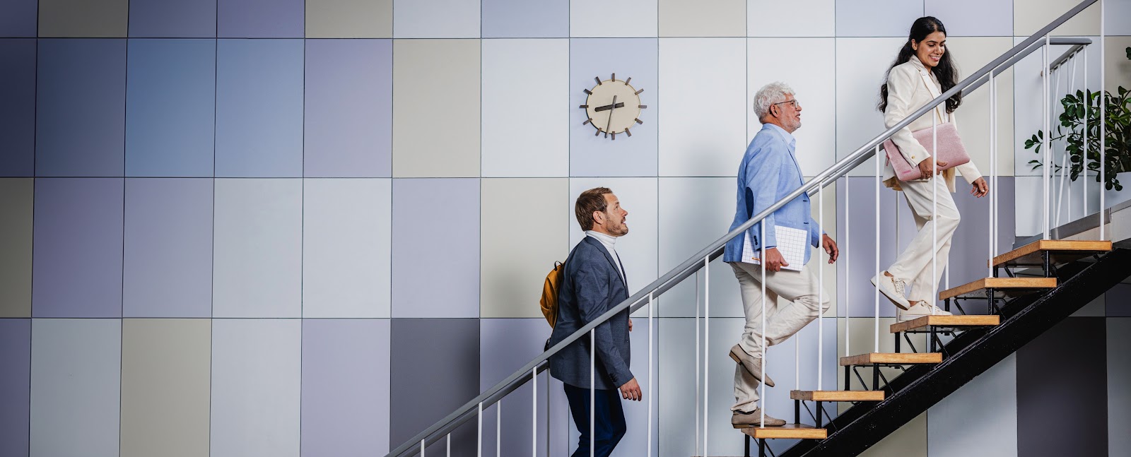 People on stairs in a modern office