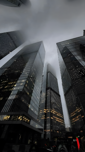 Towering Skyscrapers Vanishing Into Foggy Sky - Free mobile Wallpaper