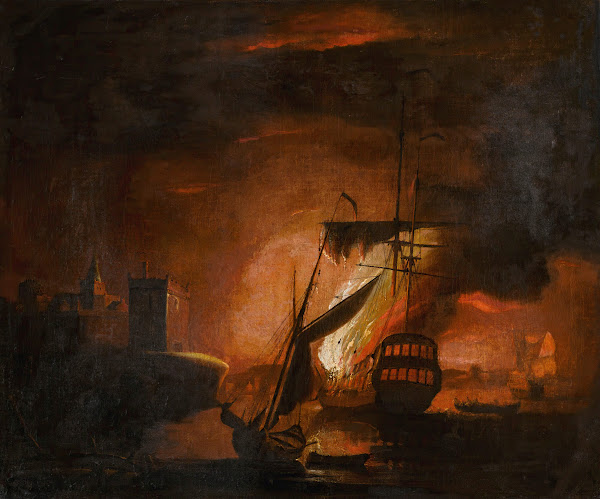 A ship on fire at night