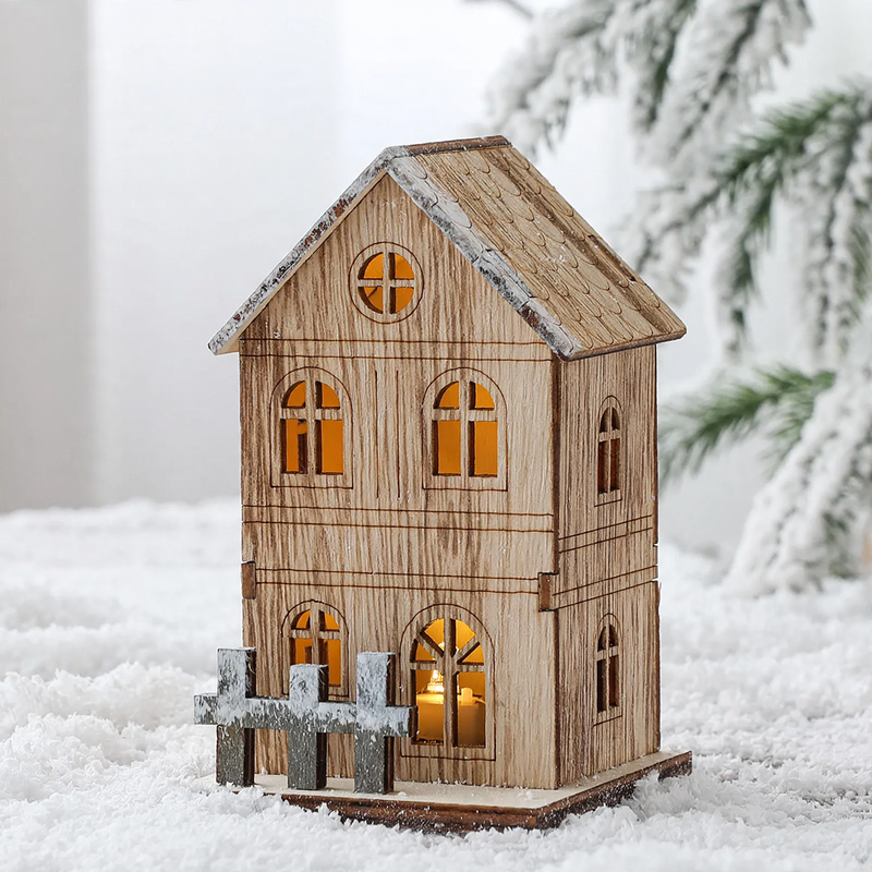 Illuminated wooden Christmas house in Scandinavian style