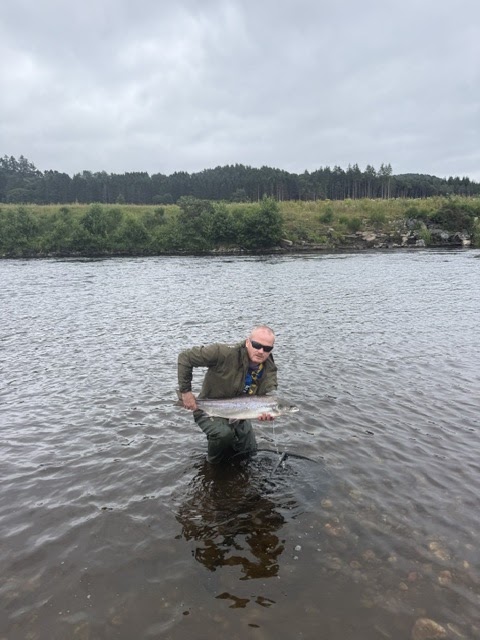 Robert Barton with a Salmon caught on a Silver Salmo Toby on the River Tay