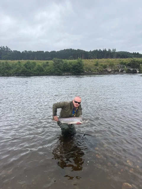 Robert Barton with a Salmon caught on a Silver Salmo Toby on the River Tay