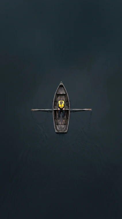 Aerial Top-Down of Solo Kayaker on Dark Water