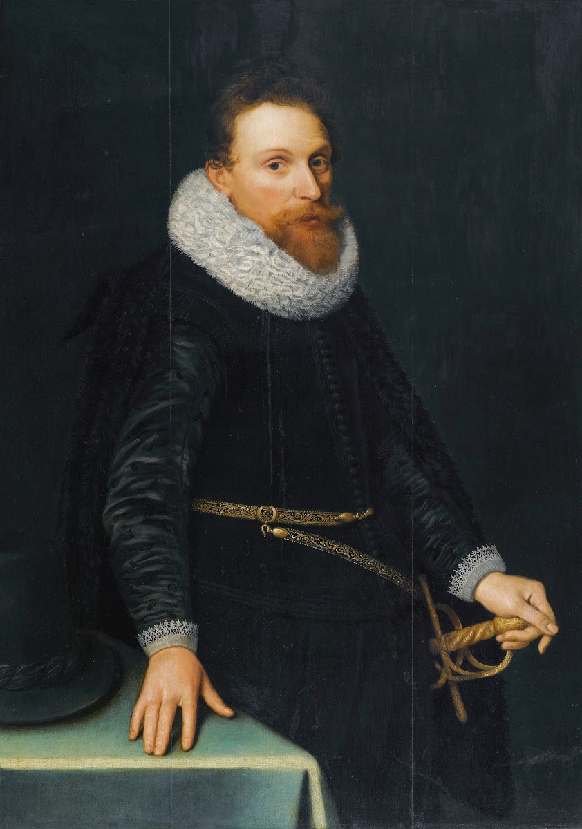 Portrait Of A Gentleman Three Quarter Length Standing Wearing A Black Tunic And