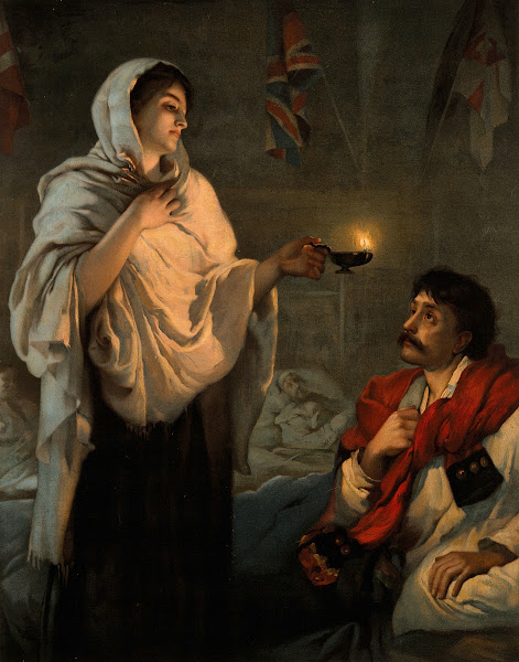 Florence Nightingale with her lamp at a patients bedside