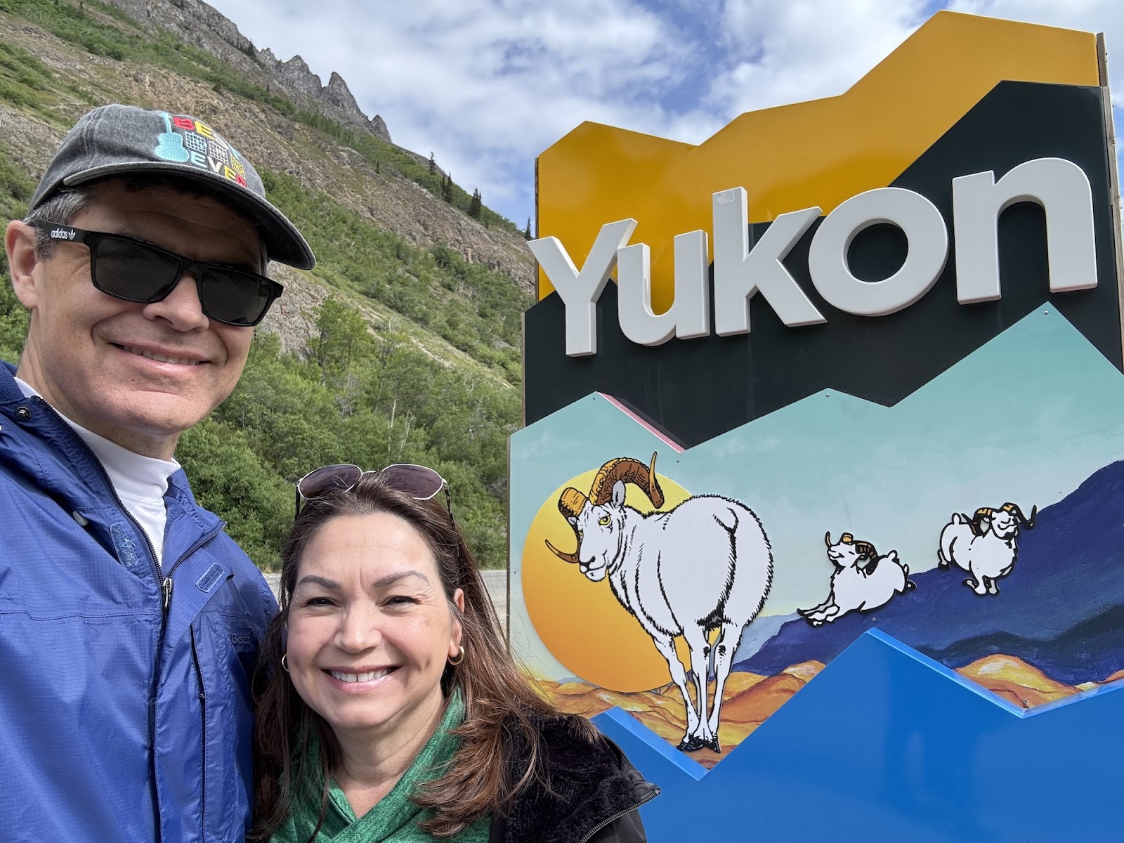 Couple at Yukon sign