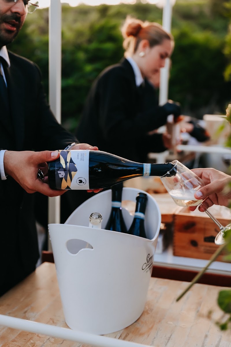 Sommelier pouring wine at a vineyard wedding, Tenuta Sorrentino