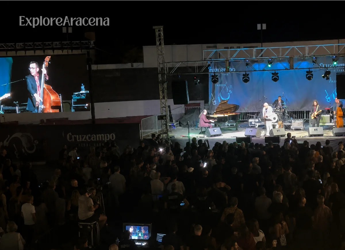 Audience view of the Aracena Blues stage and large video screen from the tiered seating inside the Plaza de Toros.