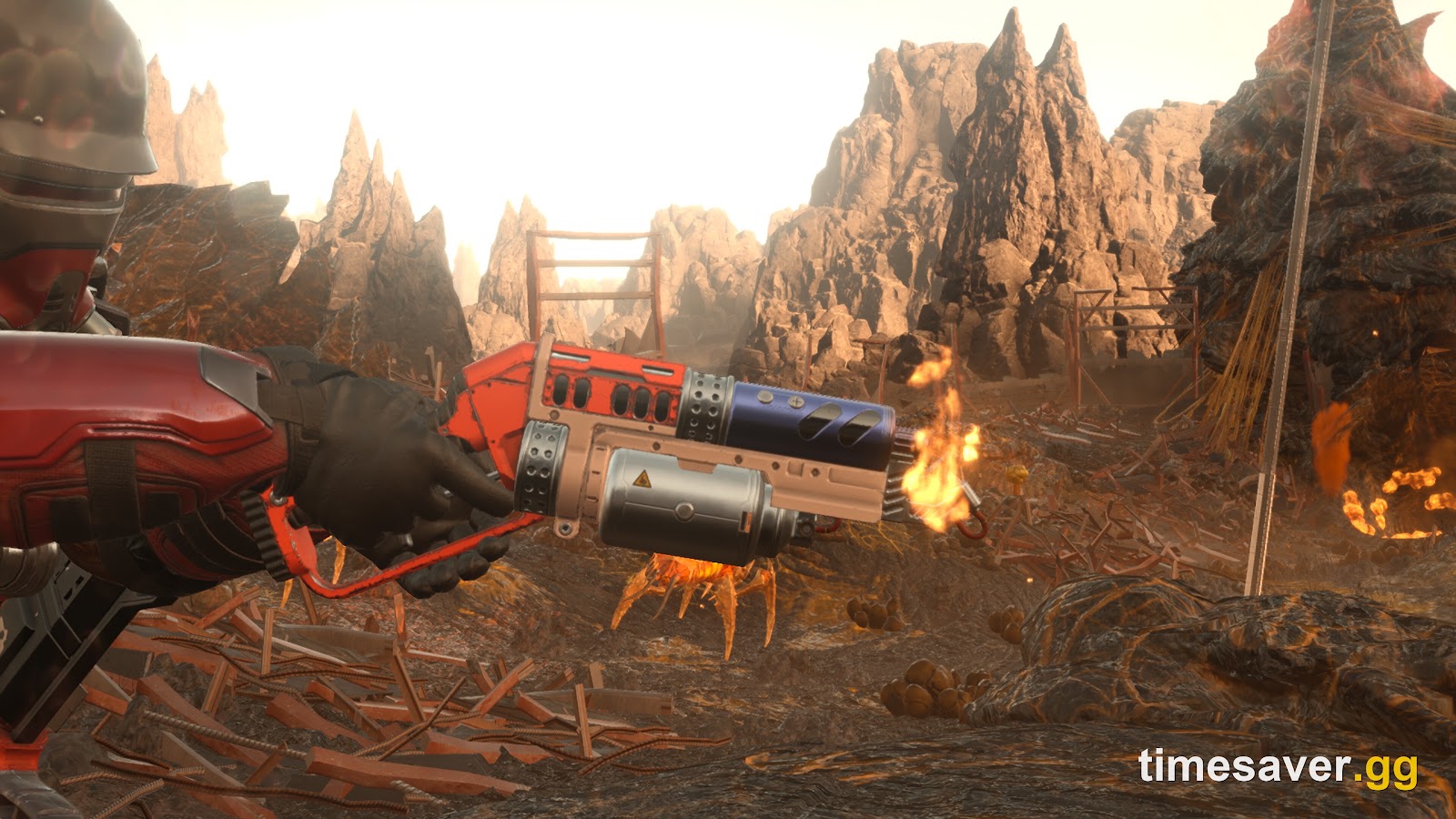 Helldivers 2 first-person view firing an incendiary weapon into a burning Terminid battlefield