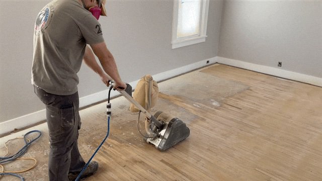 Gavin sanding hardwood floors in Central Illinois home
