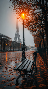 Atmospheric Autumn Park View of Eiffel Tower in Foggy Rain with Glowing Lamppost