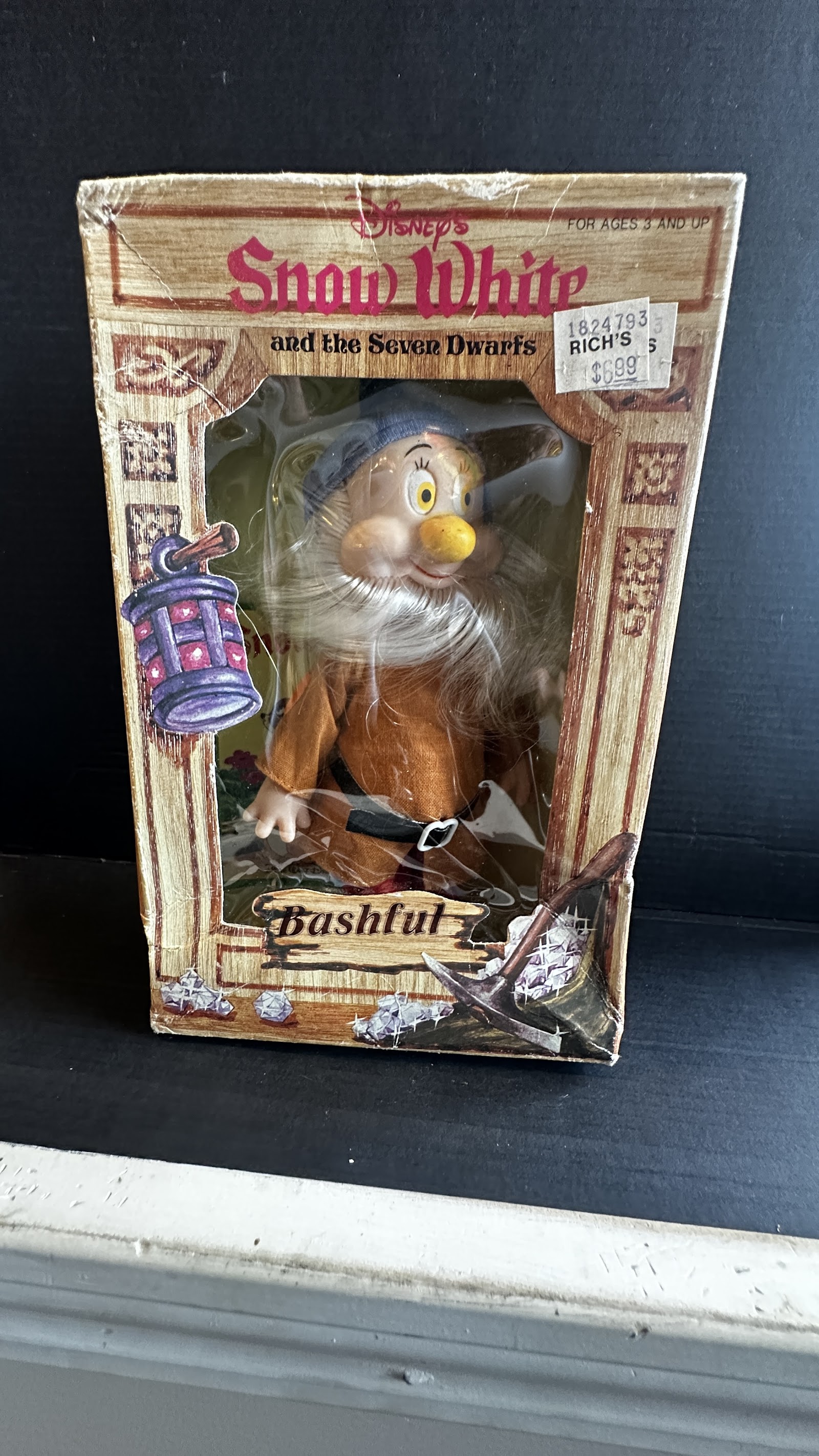 Vintage Bashful dwarf character doll in original window box, brown tunic and blue hat, white synthetic beard, Rich's price tag on box, late 1970s–early 1980s