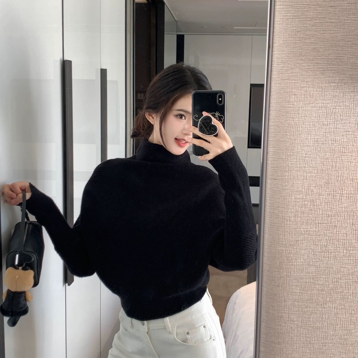 Women's knitted sweater with turtleneck and batwing sleeves