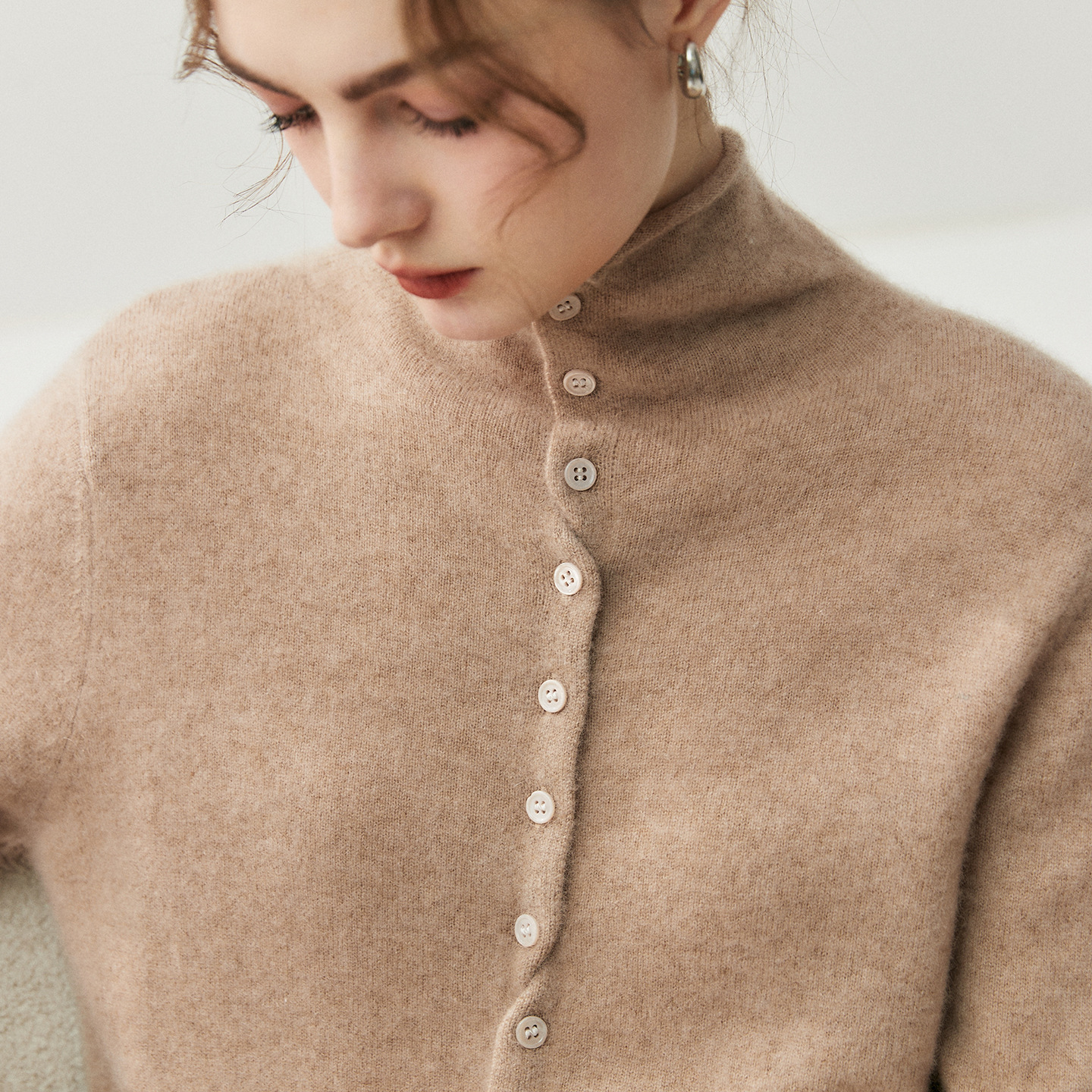 Women's cardigan with turtleneck and button closure