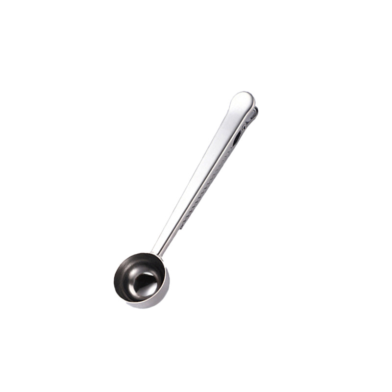 Stainless steel measuring spoon with closure clip