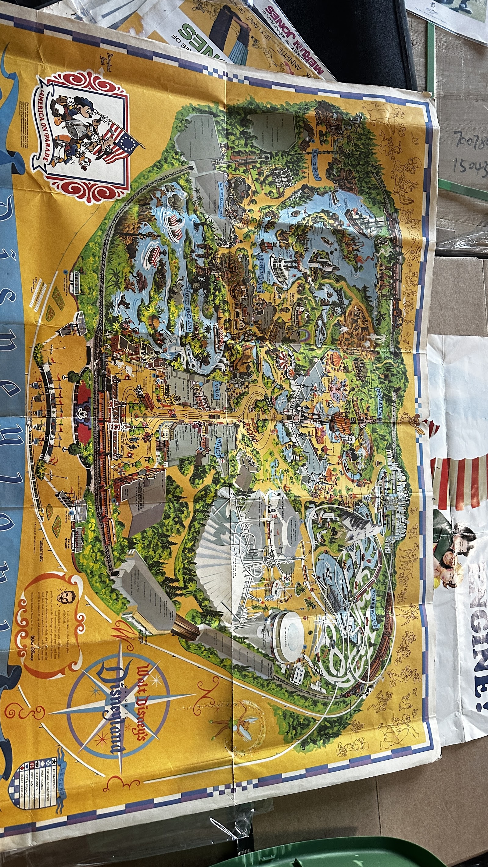 1975 Disneyland America on Parade large-format souvenir park map, approximately 30 by 45 inches, with Bicentennial branding and Disney character artwork, showing fold creases and age-appropriate wear